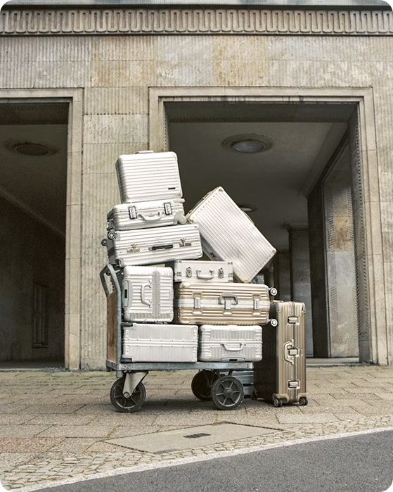 Stacked travel luggage on a cart